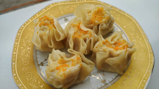 istock Steamed dimsum dumplings on a plate 1415933978