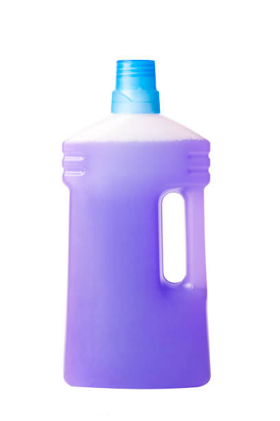 istock Purple plastic bottle of detergent or fabric softener, isolated on a white background. Front view. Studio shoot. Copy space for logo 1415935278