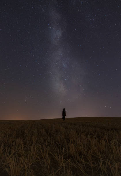 istock A woman under the milky way galaxy 1415937340
