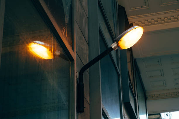 istock A lighted external lamp leaning against a wall outside the building during the day 1415938810