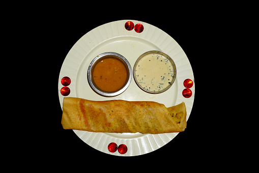 famous south indian food dosa with coconut sauce.