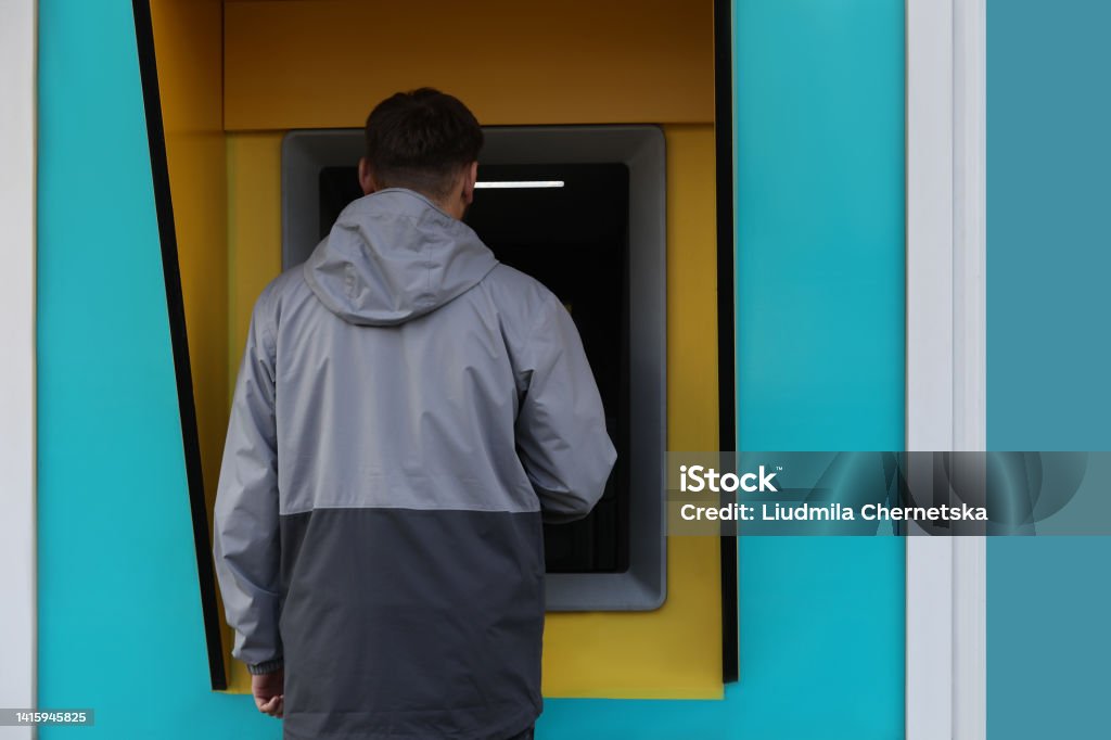 Human Cash Machine Man Using Modern Cash Machine Outdoors Back View Stock Photo - Download ...