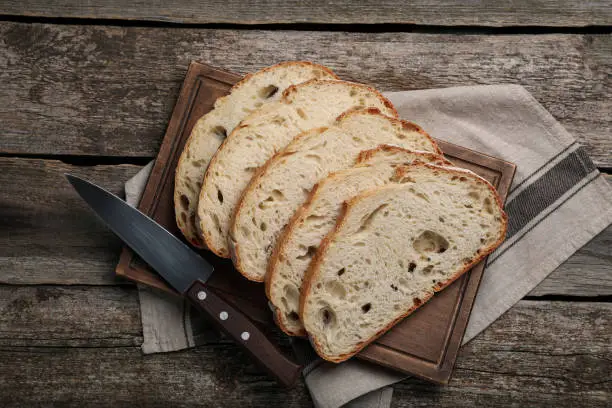 Freshly baked sodawater bread on wooden table, flat lay