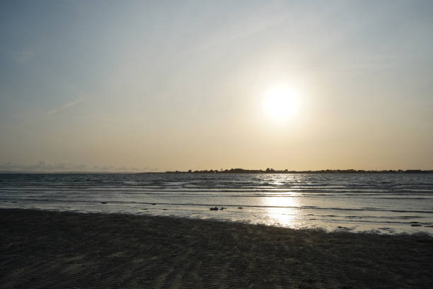 istock View of the ocean lapping on a sandy shore 1415947037