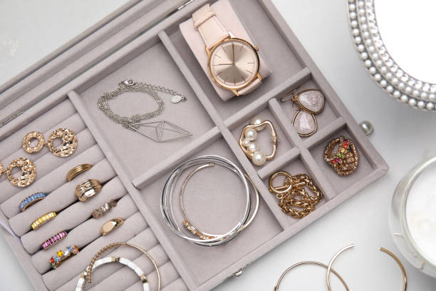 istock Elegant jewelry box with beautiful bijouterie on white table, flat lay 1415948854