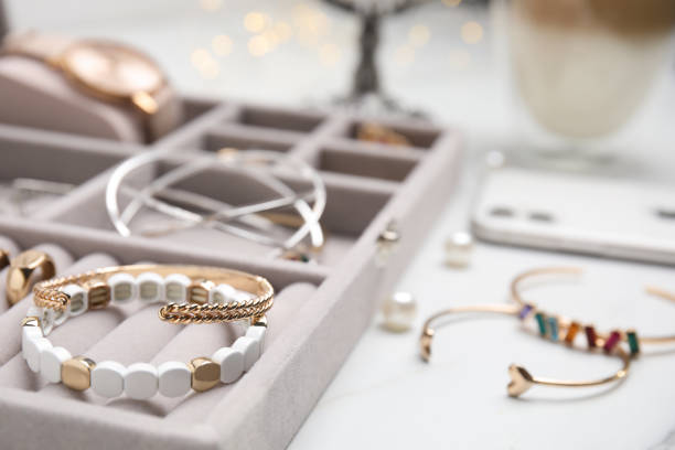 istock Elegant jewelry box with beautiful bijouterie on white table, closeup 1415948881