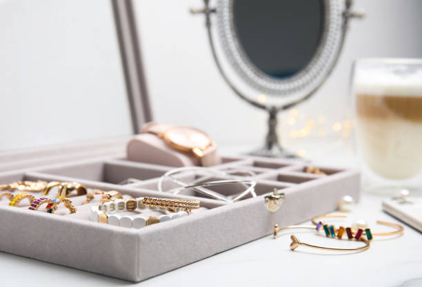 istock Elegant jewelry box with beautiful bijouterie on white table, closeup 1415950210