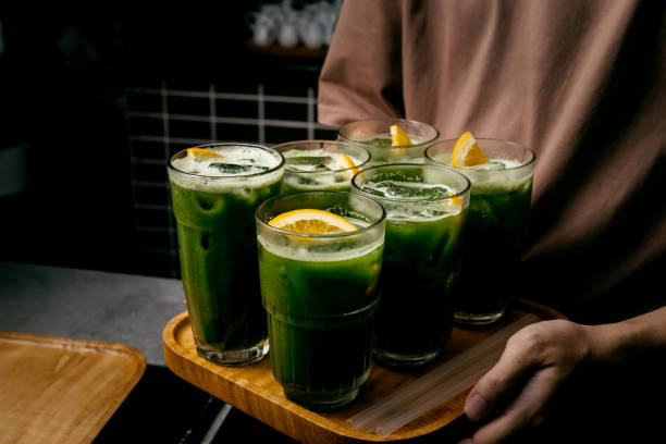 Spinach Juices with Orange Served In Coffee Shop stock photo