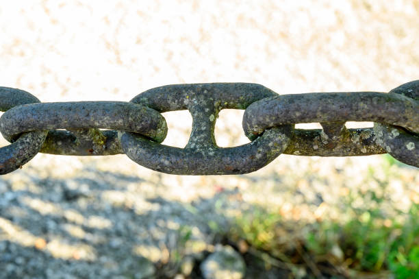 Closeup of old weathered rusty giant metallic chain
