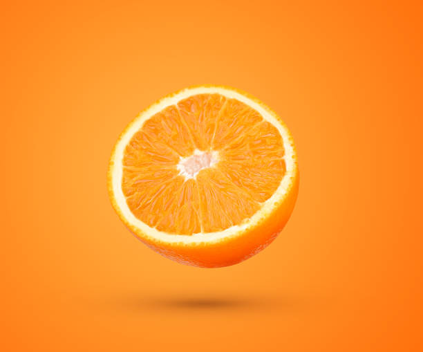 Slice of fresh orange fruit isolated on orange