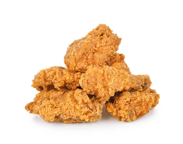 Heap of fried chicken isolated on white
