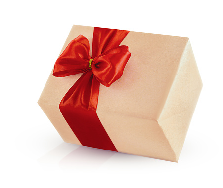 gift in craft paper with a red silk bow isolated on a white background with shadow and reflection