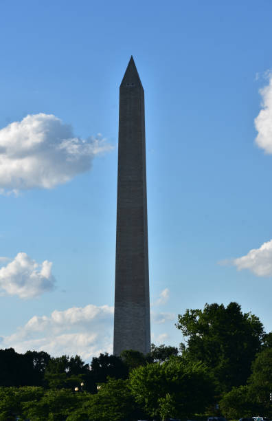 istock Towering Washington Monument Against a Cloud Filled Sky 1415953014