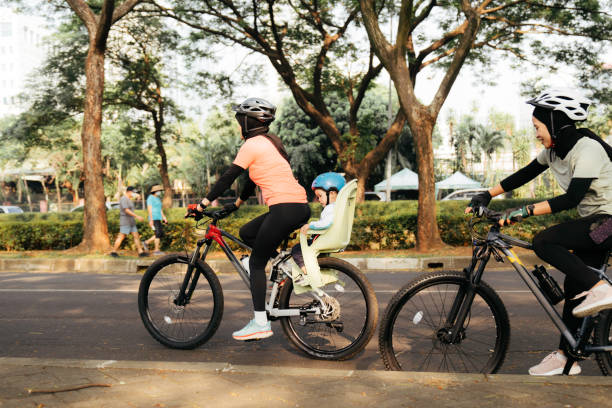 istock muslim woman riding bicycle 1415954999