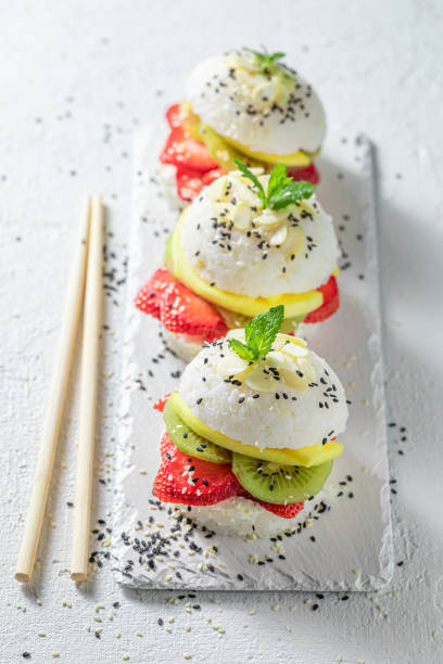 istock Fresh sushi burger with strawberries and mascarpone on white plate. 1415956713
