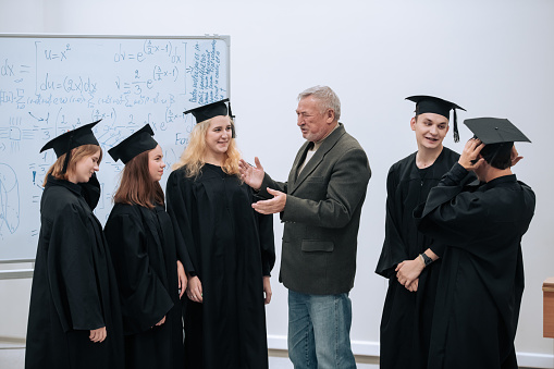 The rector of the university, a professor of mathematics, personally congratulates each of the graduates of the students, congratulates them on the completion of their studies.