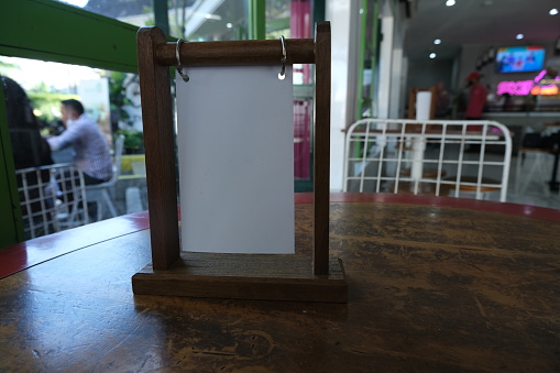 blank menu label frame in bar restaurant for mock up