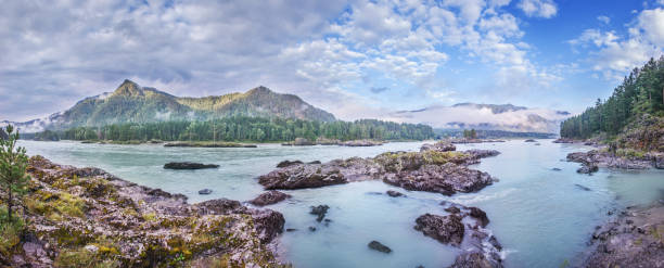 istock Panoramic view of a mountain river, rocky banks, cloudy 1415963035