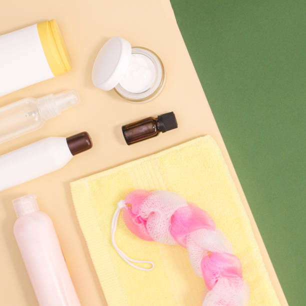 istock Creative beauty produts on beige and green background with copy space. Flat lay 1415965094