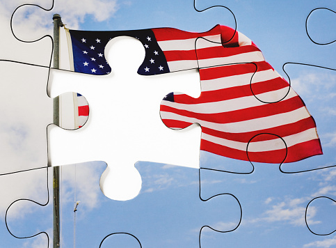 Representing problems and solutions, a jigsaw puzzle of the Stars and Stripes with a gap for the last missing piece.