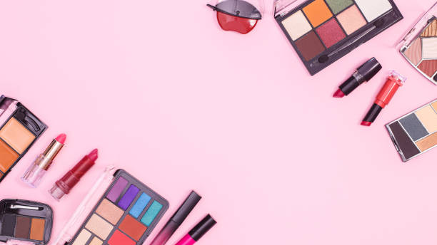 istock Colorful make up products layout on pastel pink background with copy space. Flat lay 1415965900