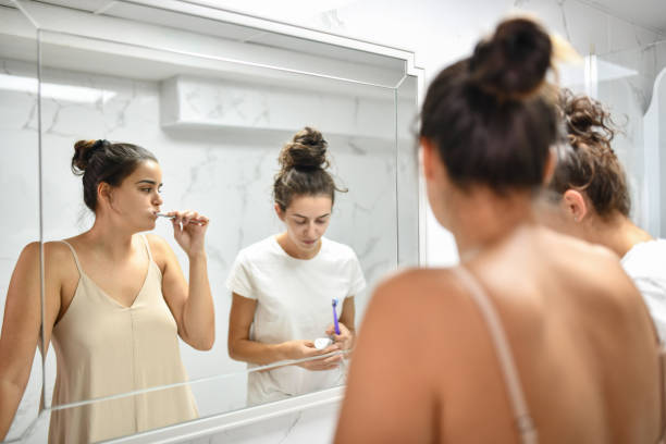 istock Female Talking To Girlfriend About New Toothpaste Properties 1415967978