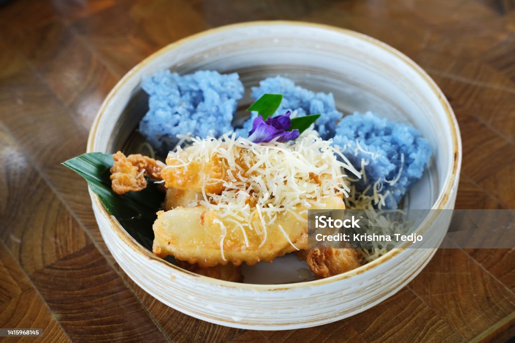 Sweet fried banana with grated cheese and sticky rice Appetizer Stock Photo