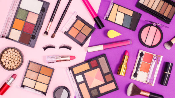 Make up products pattern on pink and purple background. Flat lay Make up products pattern on pink and purple background. Flat lay Makeup stock pictures, royalty-free photos & images
