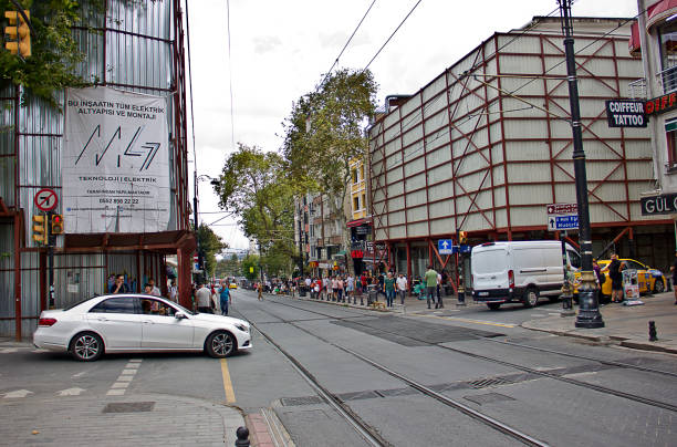 Istanbul,Turkey - August 10, 2022: Street view with people walking at beyazıt to sultan ahmet in the Fatih district of Istanbul. There is Modern Tram Tramway as Public Metro Transport M1 in Istanbul in Turkey.