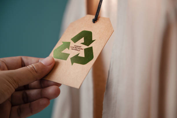 istock Recycling Products Concept. Organic Cotton Recycling Cloth. Zero Waste Materials. Environment Care, Reuse, Renewable for Sustainable Lifestyle. Recycle Icon show on Tag 1415971783