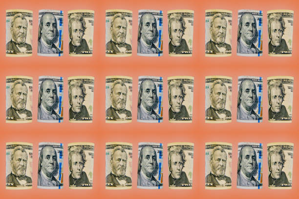 Currency portraits of President Grant, Ben Franklin, and President Andrew Jackson taken from rolled-up fifty dollar, one hundred dollar, and twenty dollar bills. The eyes of been subtly colored.  There is a total of $1,530 represented. The eyes appear to be looking at you.