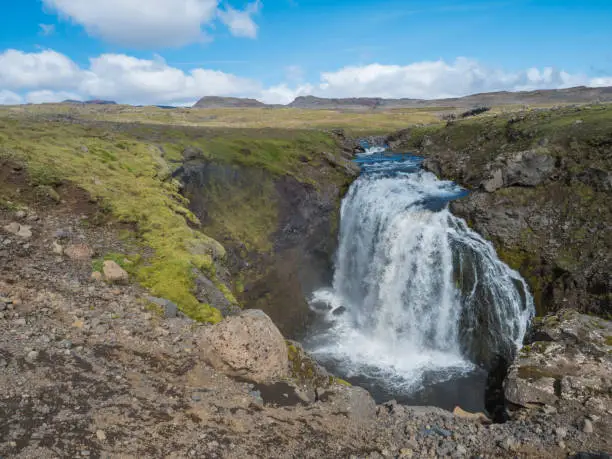 Photo of Beautifull waterfall on the Skoga River with no people on famous Fimmvorduhals trail second part of Laugavegur trek. Summer landscape on a sunny day. Amazing in nature. August 2019, South Iceland