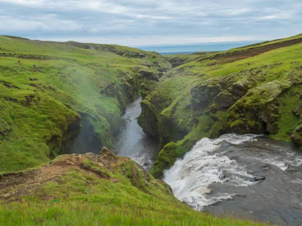 Photo of Beautifull waterfall on the Skoga River with no people on famous Fimmvorduhals trail second part of Laugavegur trek. Summer landscape on a sunny day. Amazing in nature. August 2019, South Iceland