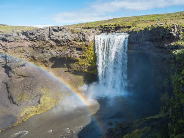 Photo of Beautifull waterfall on the Skoga River with rainbow and no people on famous Fimmvorduhals trail second part of Laugavegur trek. Summer landscape on a sunny day. Amazing in nature. August 2019, South Iceland