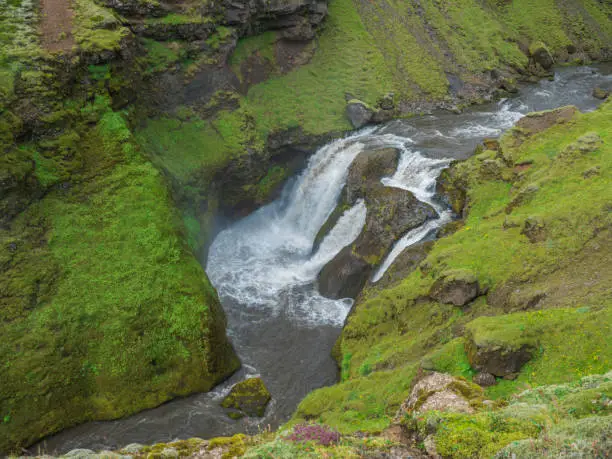 Photo of Beautifull waterfall on the Skoga River with rainbow and no people on famous Fimmvorduhals trail second part of Laugavegur trek. Summer landscape on a sunny day. Amazing in nature. August 2019, South Iceland