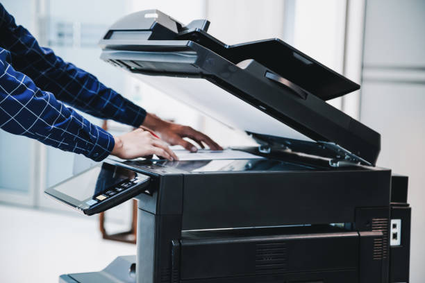 copier printer, close up hand office man press copy button on panel to using the copier or photocopier machine for scanning document printing a sheet paper. - print computer printer printout push button imagens e fotografias de stock