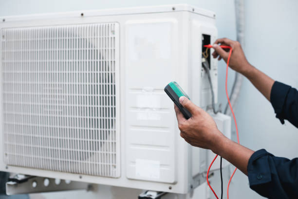 istock Air conditioner technicians use a multimeter to check electricity and Part of the preparation to install a new air conditioner. 1415976529