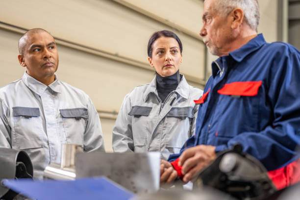 istock Multiracial group of production workers with serious facial expression 1415978431