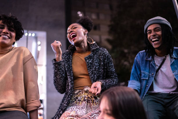 istock Friends having fun in the street at night 1415978687