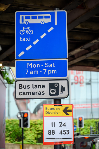 LONDON - May 20, 2022: Permanent and temporary Traffic signs on post i near Waterloo Station