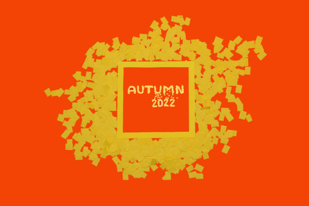 istock orange-yellow background with yellow frame that says autumn 2022, creative art design with trendy autumn colors 1415981697