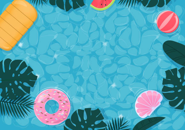 istock Colorful swimming ring and leaves floating in the pool 1415985284
