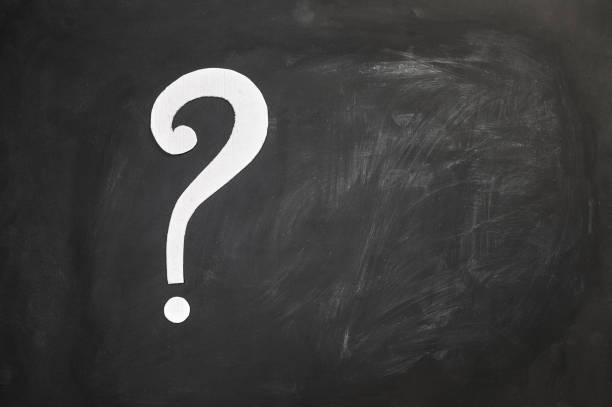 istock question mark made of cardboard on chalkboard background with copy space. 1415985709