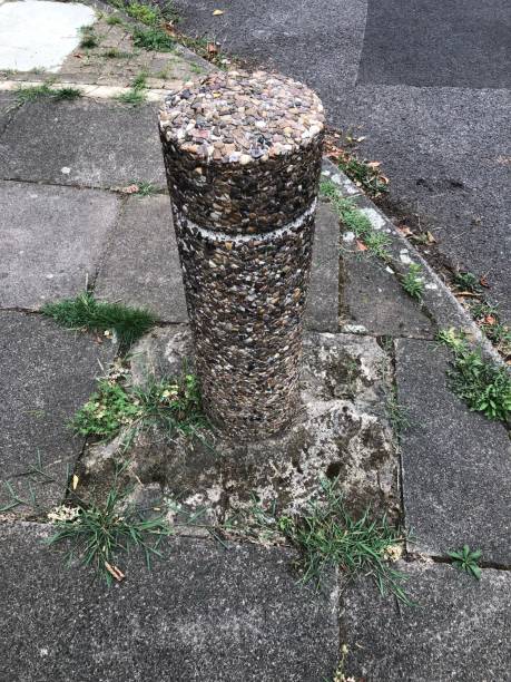 istock A concrete bollard with pebbles on it 1415986256