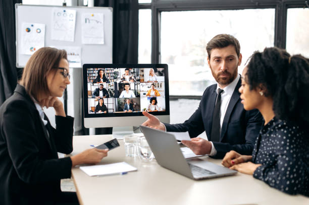 istock Group cooperation by video call. Business multiracial colleagues, discussing new project, generating new ideas, communicating via video conference with their business partners from different countries 1415987341