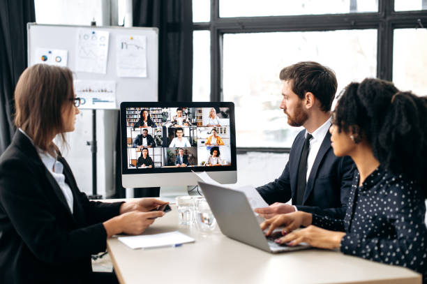 istock Business multiracial colleagues, discussing new project, generating new ideas, communicating via video conference with their business partners from different countries. Group cooperation by video call 1415987342