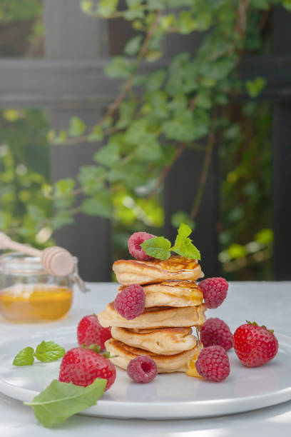 istock Pancakes with wild berries on the table. Healthy breakfast. 1415995481