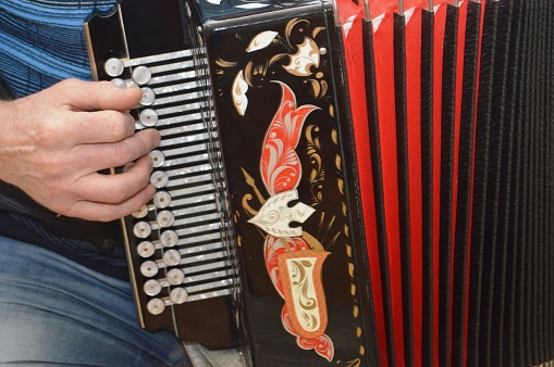 playing the ancient musical instrument button accordion