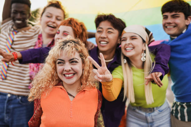 istock Happy diverse people having fun at LGBT pride parade 1416001706