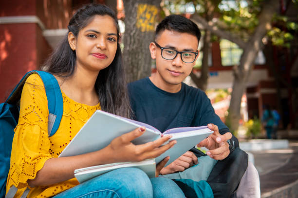 istock Multiethnic college student friends studying together at campus. 1416002603